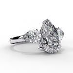 Load image into Gallery viewer, Pear Cut Moissanite Engagement Ring with Pear Side Stones
