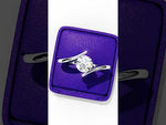 Load and play video in Gallery viewer, Bypass Round Cut Moissanite Engagement Ring | Modern Solitaire Twist Design | 18K Gold or Platinum
