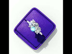 Load and play video in Gallery viewer, Oval Cut Lab Grown Diamond Engagement Ring with Cluster Side Stones
